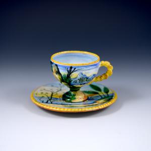 Tazza da caffè con piattino con decoro a paesaggi